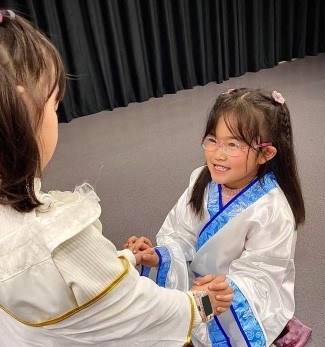 Students performing a myth in costume