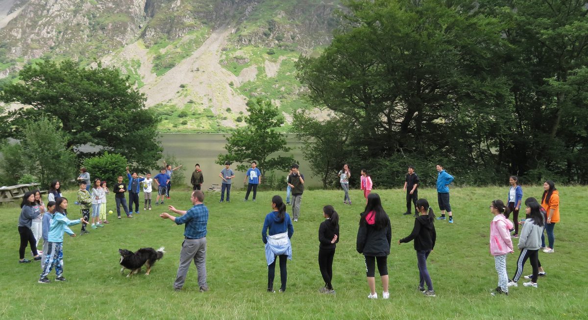 A game on the lawn below the fells